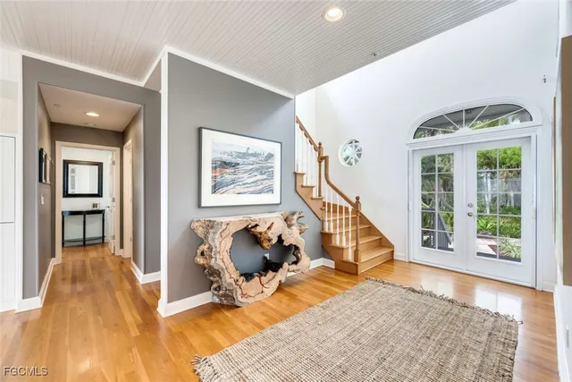 a view of a livingroom with furniture and staircase