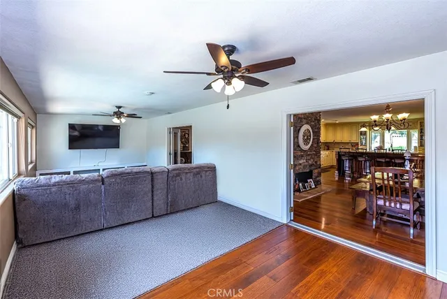a view of a livingroom with furniture and a flat screen tv