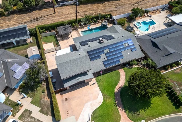 an aerial view of a house with a garden