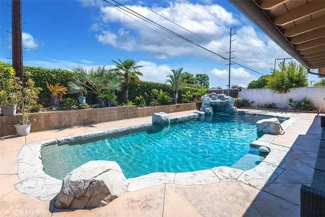 a view of a backyard with plants and lake view