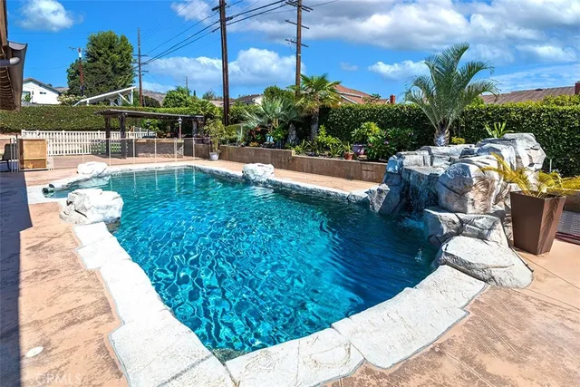 a view of a swimming pool with a patio
