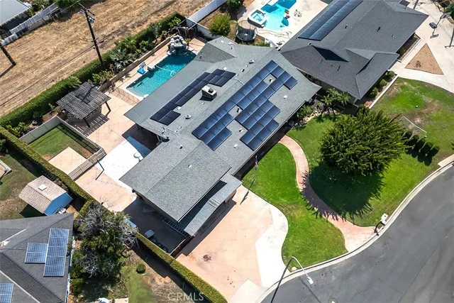 an aerial view of a house with a garden