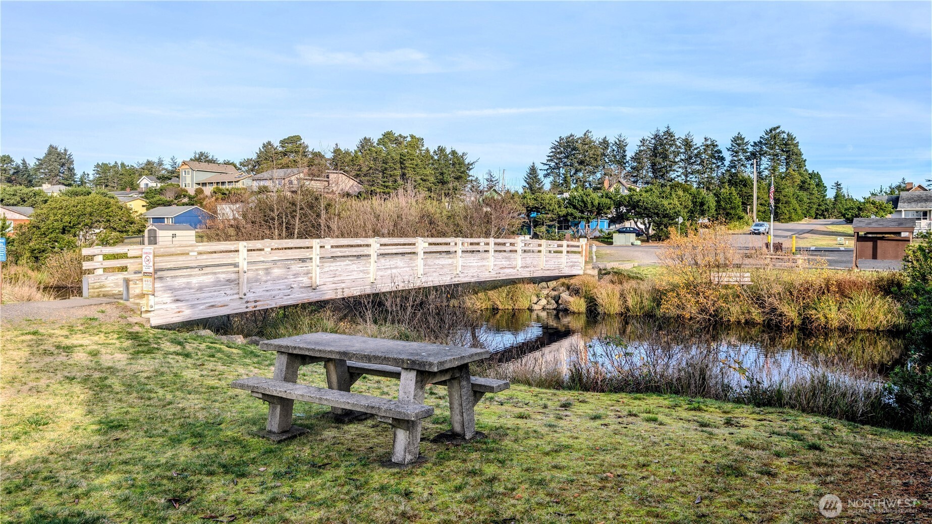 30904 M Place Ocean Park, WA 98640 - Photo 7 of 15 a view of a swimming pool with a yard and furniture