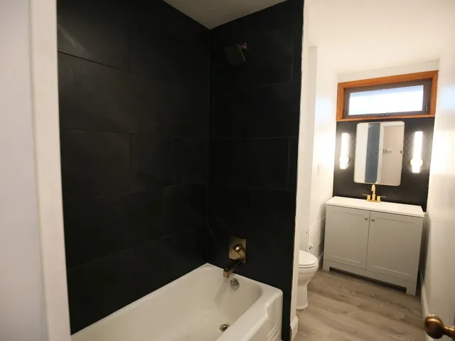 a bathroom with a sink and a bathtub