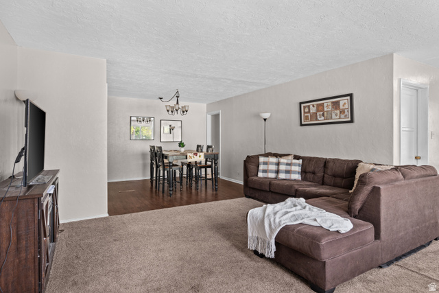 88 East C Street Springville, UT 84663 - Photo 5 of 32 Open-concept living area featuring light-colored walls and a textured ceiling