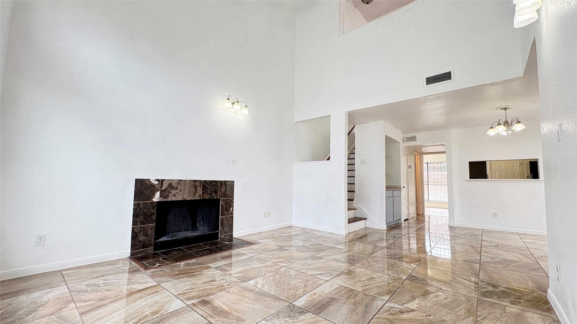 6633 West Airport Boulevard, Unit 101 Houston, TX 77035 - Photo 1 of 25 a view of an empty room with a fireplace