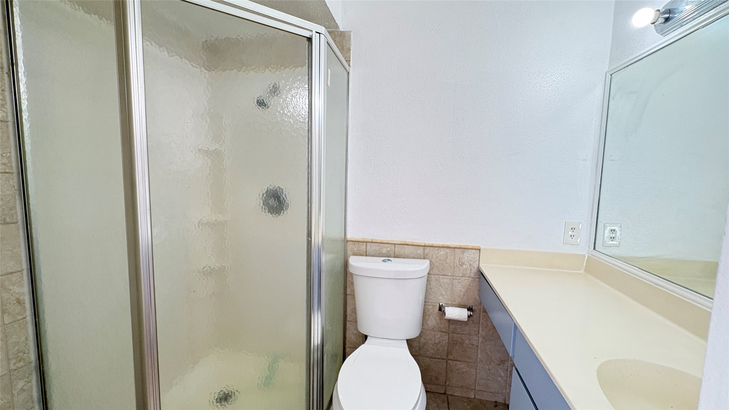 6633 West Airport Boulevard, Unit 101 Houston, TX 77035 - Photo 15 of 25 a bathroom with a toilet and a shower