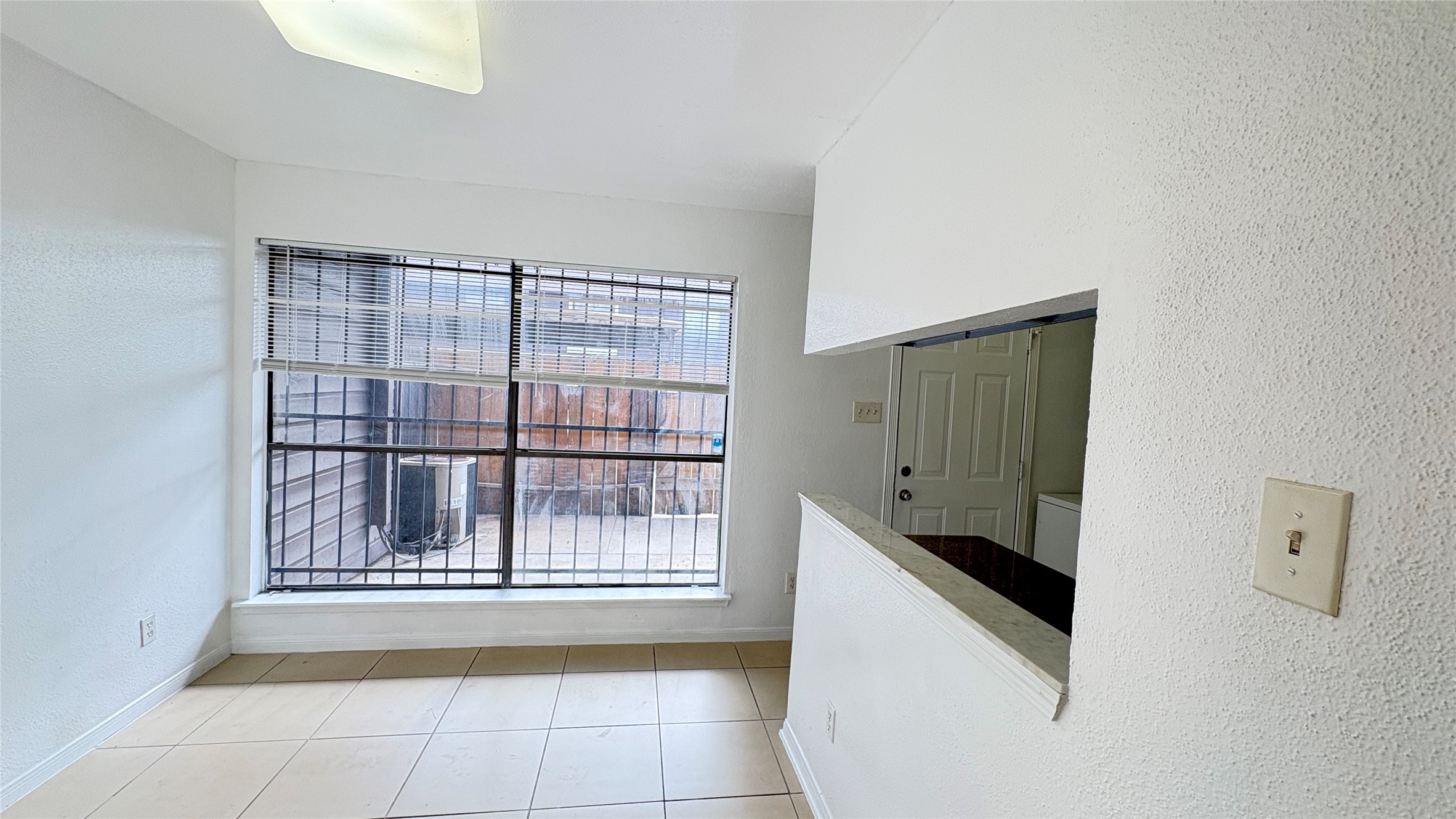 6633 West Airport Boulevard, Unit 101 Houston, TX 77035 - Photo 19 of 25 a spacious bathroom with a granite countertop bathtub next to a window