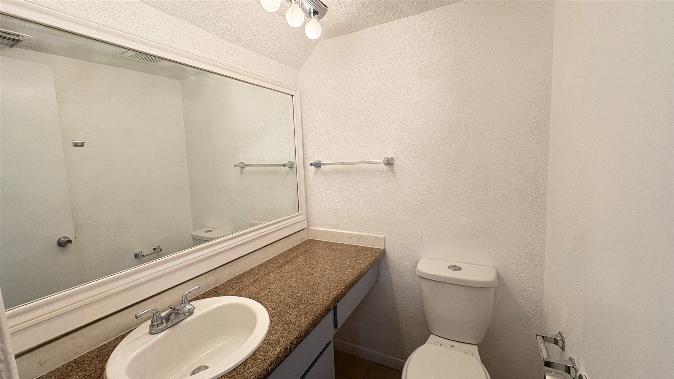 6633 West Airport Boulevard, Unit 101 Houston, TX 77035 - Photo 21 of 25 a bathroom with a granite countertop sink toilet and shower
