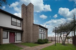 6633 West Airport Boulevard, Unit 101 Houston, TX 77035 - Photo 24 of 25 a front view of a house with a yard
