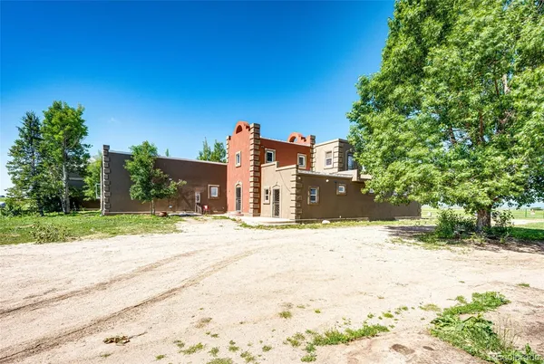 a view of a house with a road