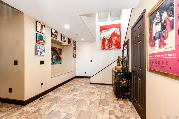 a view of an entryway with wooden floor