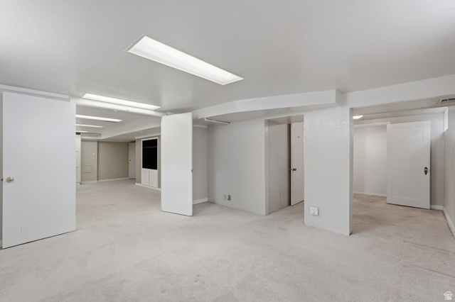 378 West 200 South Bountiful, UT 84010 - Photo 21 of 32 Spacious room featuring light-colored carpeting, white walls, and multiple recessed fluorescent lighting fixtures