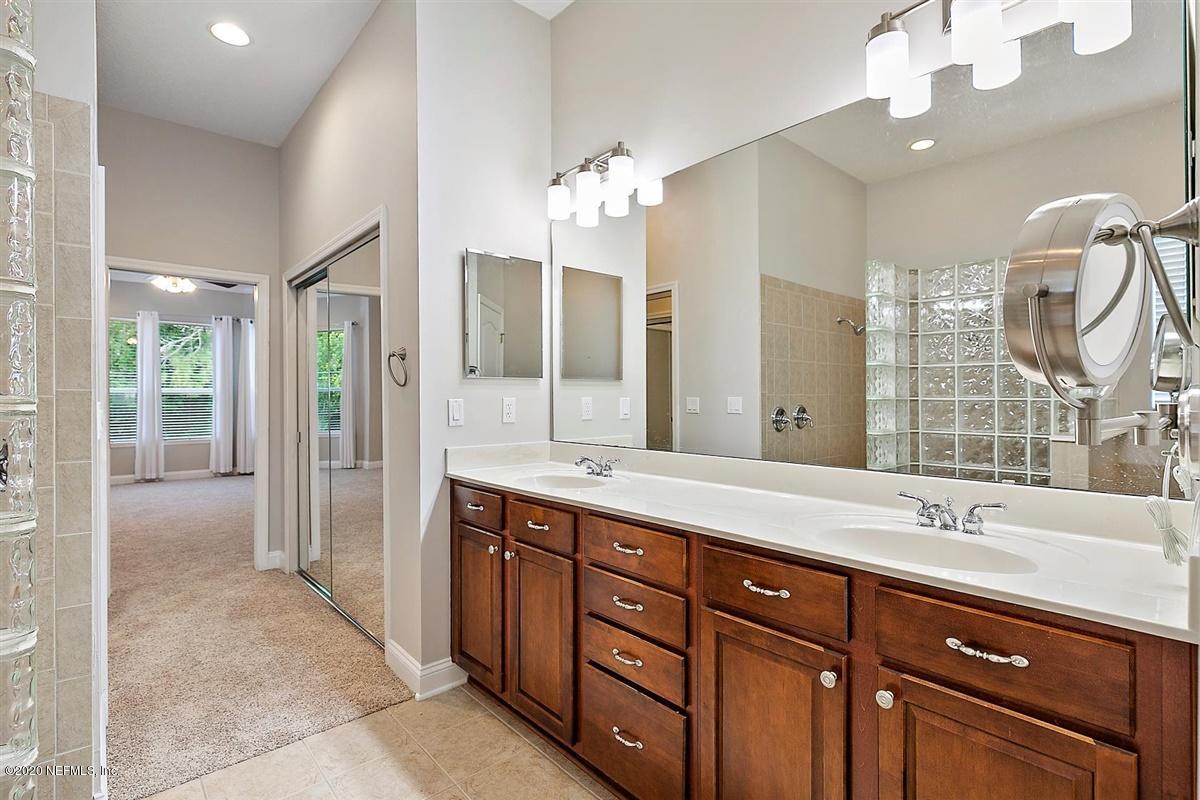 1320 Powis Road St. Augustine, FL 32095 - Photo 17 of 32 a spacious bathroom with a double vanity sink mirror and double