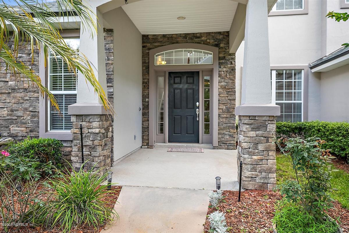 1320 Powis Road St. Augustine, FL 32095 - Photo 2 of 32 a front view of a house with a garden
