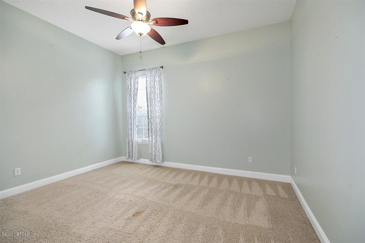 1320 Powis Road St. Augustine, FL 32095 - Photo 23 of 32 an empty room with windows and fan