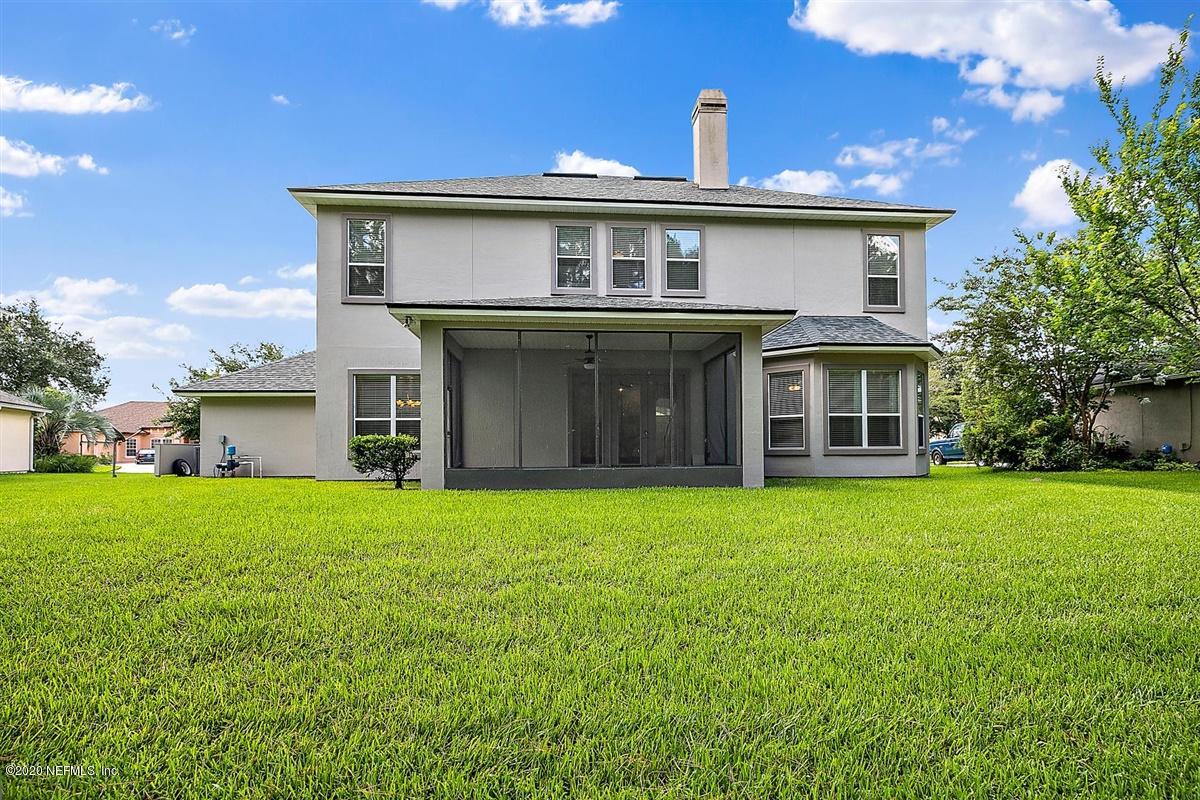 1320 Powis Road St. Augustine, FL 32095 - Photo 29 of 32 a front view of a house with a garden and yard