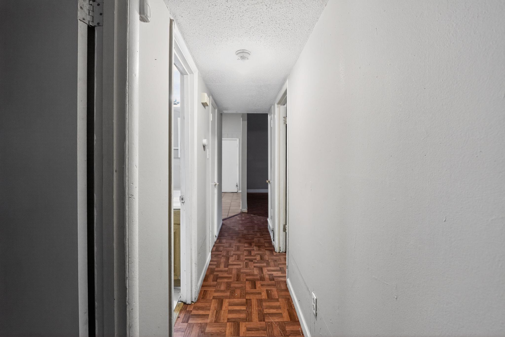 4504 Neely Road Memphis, TN 38109 - Photo 24 of 32 a view of a hallway with wooden floor and staircase