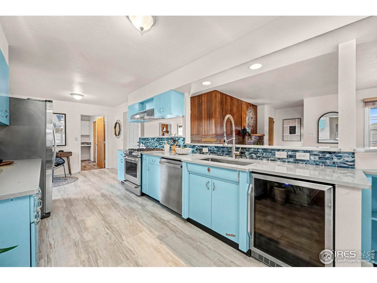 805 Colorado Street Fort Collins, CO 80524 - Photo 15 of 45 a open kitchen with granite countertop a stove top oven sink and cabinets