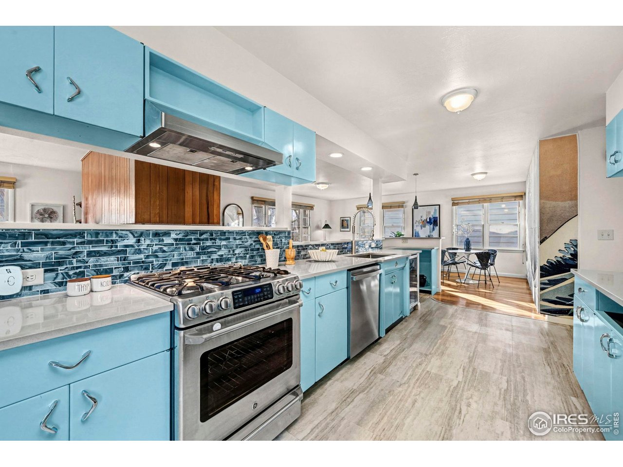 805 Colorado Street Fort Collins, CO 80524 - Photo 17 of 45 a kitchen with stainless steel appliances granite countertop a stove and a sink