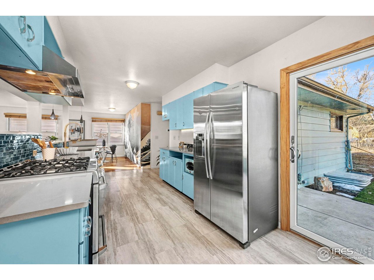 805 Colorado Street Fort Collins, CO 80524 - Photo 19 of 45 a kitchen with stainless steel appliances granite countertop a refrigerator and a sink
