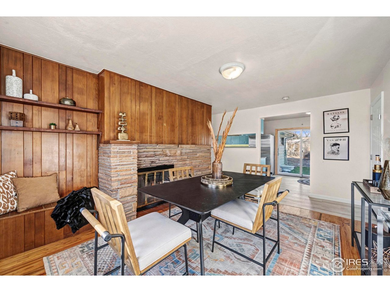 805 Colorado Street Fort Collins, CO 80524 - Photo 23 of 45 a dinning room with a table chairs and a kitchen view