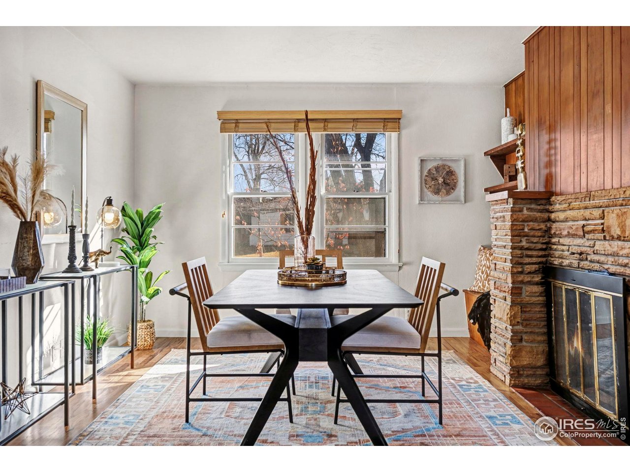 805 Colorado Street Fort Collins, CO 80524 - Photo 24 of 45 a view of a dining room with furniture and wooden floor