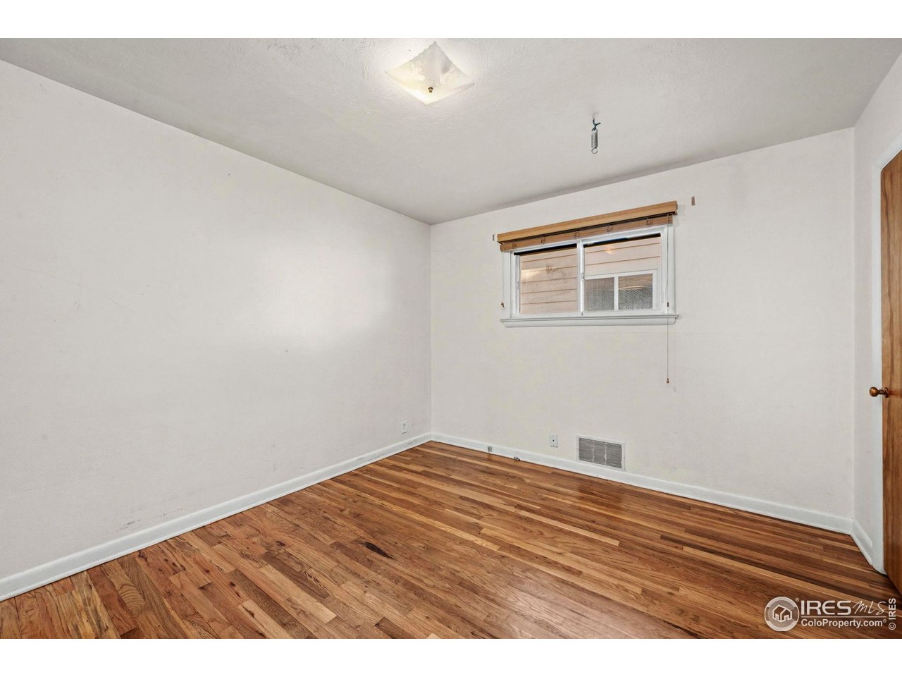 805 Colorado Street Fort Collins, CO 80524 - Photo 28 of 45 a view of empty room with wooden floor
