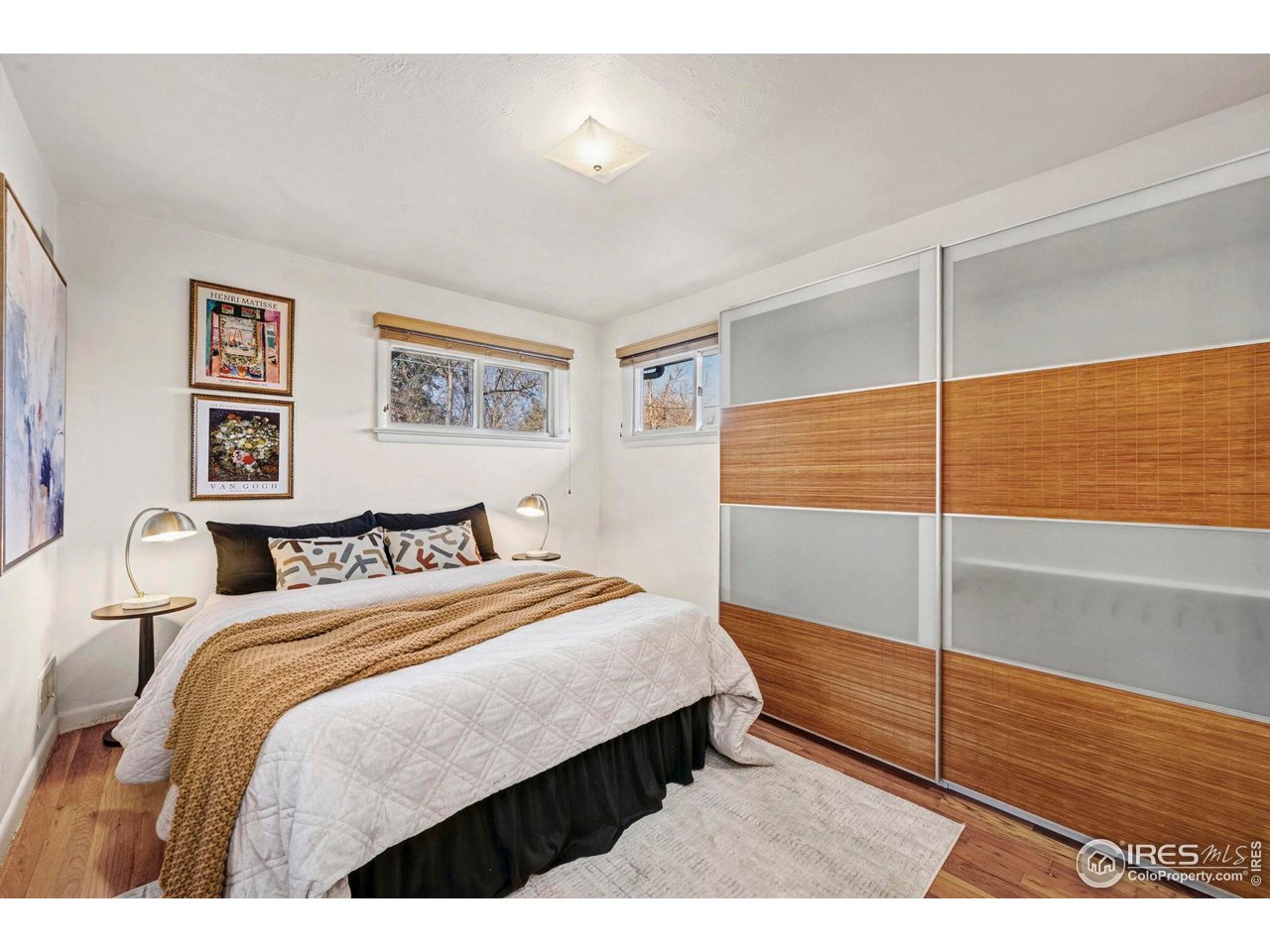 805 Colorado Street Fort Collins, CO 80524 - Photo 32 of 45 a bedroom with a bed and painting on the wall