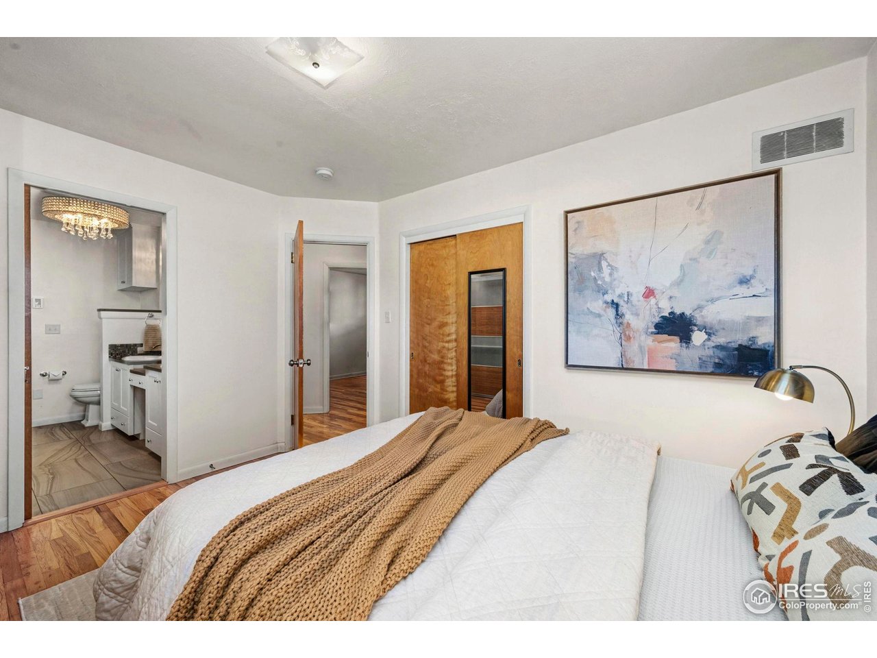 805 Colorado Street Fort Collins, CO 80524 - Photo 33 of 45 a bedroom with a bed and a painting on the wall