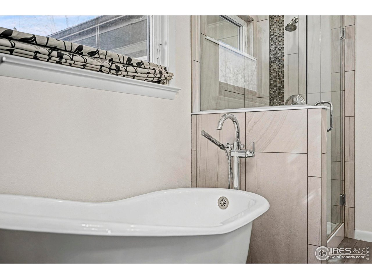 805 Colorado Street Fort Collins, CO 80524 - Photo 36 of 45 a bathroom with a bathtub and shower