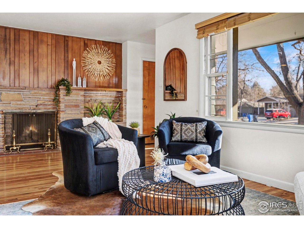 805 Colorado Street Fort Collins, CO 80524 - Photo 10 of 45 a living room with furniture a large window and wooden floor