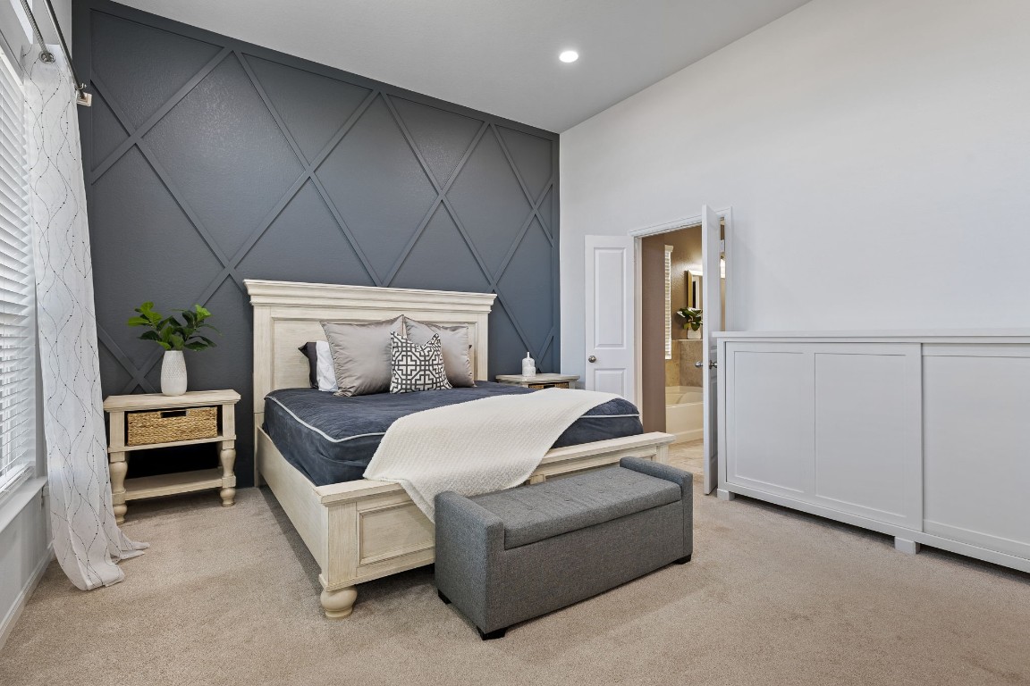 408 Ravello Street Liberty Hill, TX 78642 - Photo 17 of 40 a bedroom with furniture and a couch