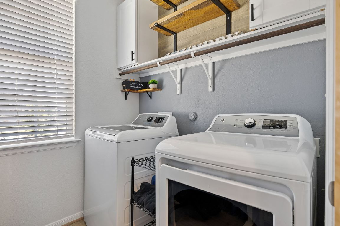 408 Ravello Street Liberty Hill, TX 78642 - Photo 21 of 40 a utility room with dryer and washer