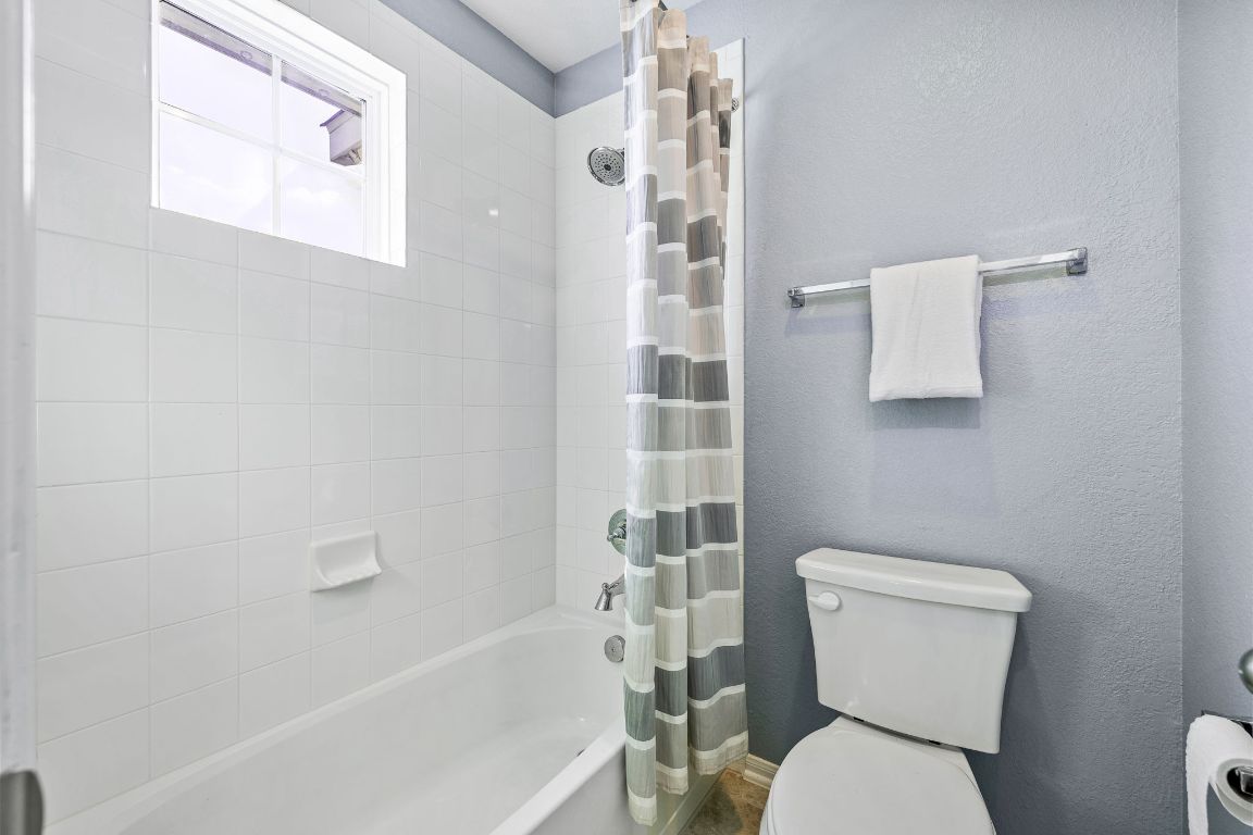 408 Ravello Street Liberty Hill, TX 78642 - Photo 25 of 40 a white toilet sitting next to a bath tub