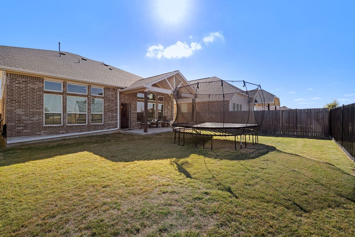 408 Ravello Street Liberty Hill, TX 78642 - Photo 35 of 40 a view of a swimming pool with a lounge chairs