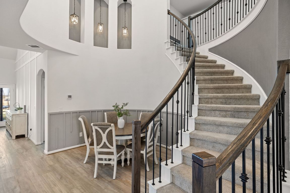 408 Ravello Street Liberty Hill, TX 78642 - Photo 4 of 40 a view of entryway and hall with wooden floor