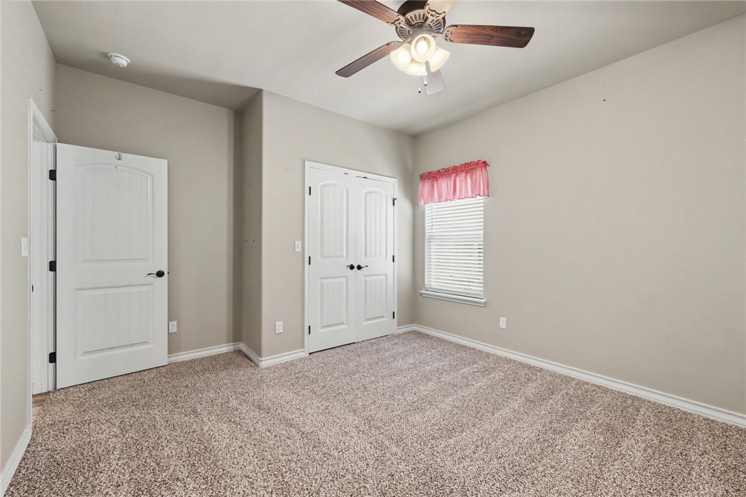 302 Cooper Road, Unit E2 Odem, TX 78370 - Photo 18 of 24 a view of an empty room with a window