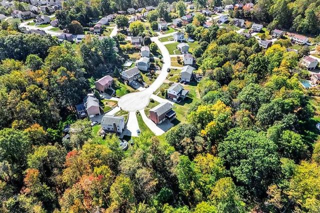 a view of a brick building next to a yard