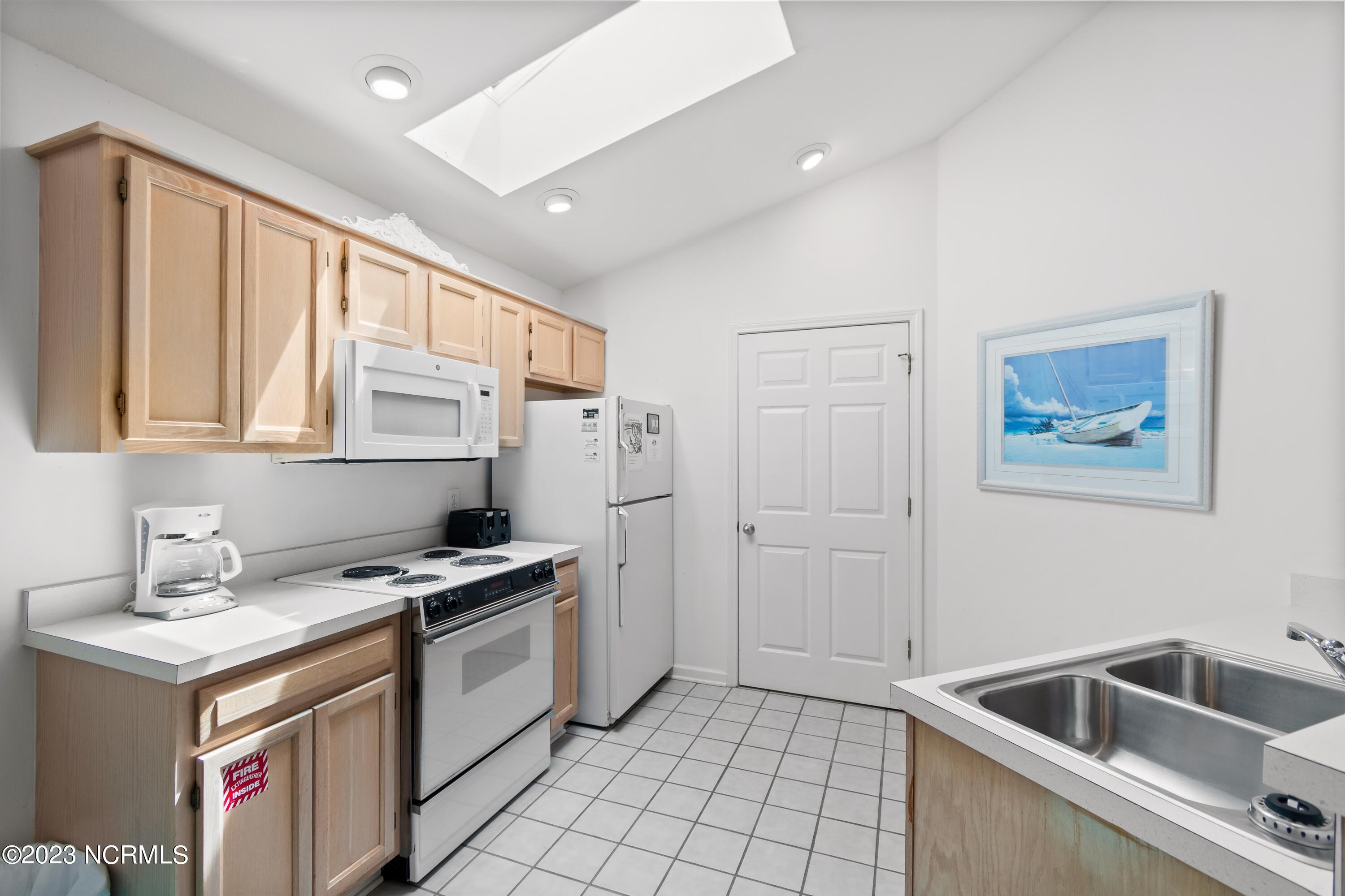 226 Clubhouse Road, Unit 17D Sunset Beach, NC 28468 - Photo 21 of 37 Plenty of cabinet storage in this large kitchen area.