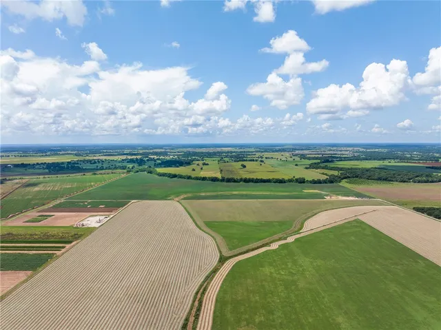 a view of a lake with a yard