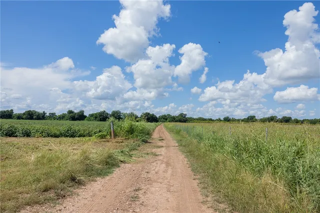 a view of a lake with houses in back