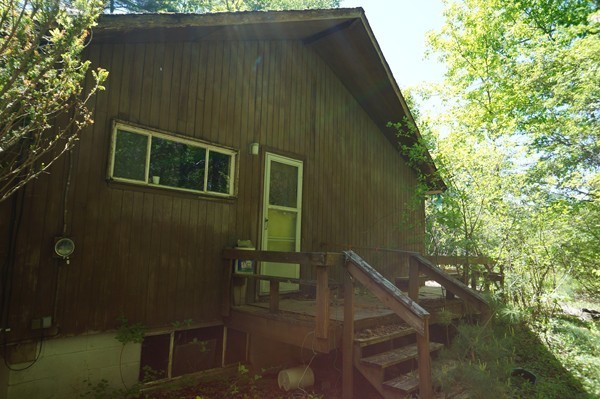 144 Red Acre Road Stow, MA 01775 - Photo 3 of 17 a backyard of a house with table and chairs