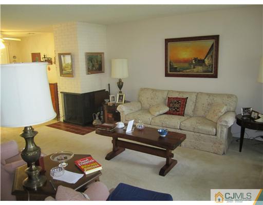 35 Haddon Road Monroe Township, NJ 08831 - Photo 2 of 6 a living room with furniture and a couch