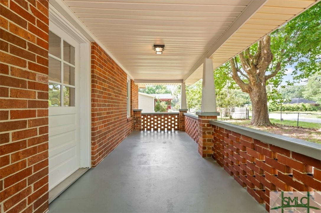 376 Chevis Road Savannah, GA 31419 - Photo 4 of 40 Front porch is ready for your rocking chairs for m