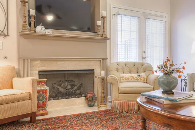 a living room with furniture and a fireplace