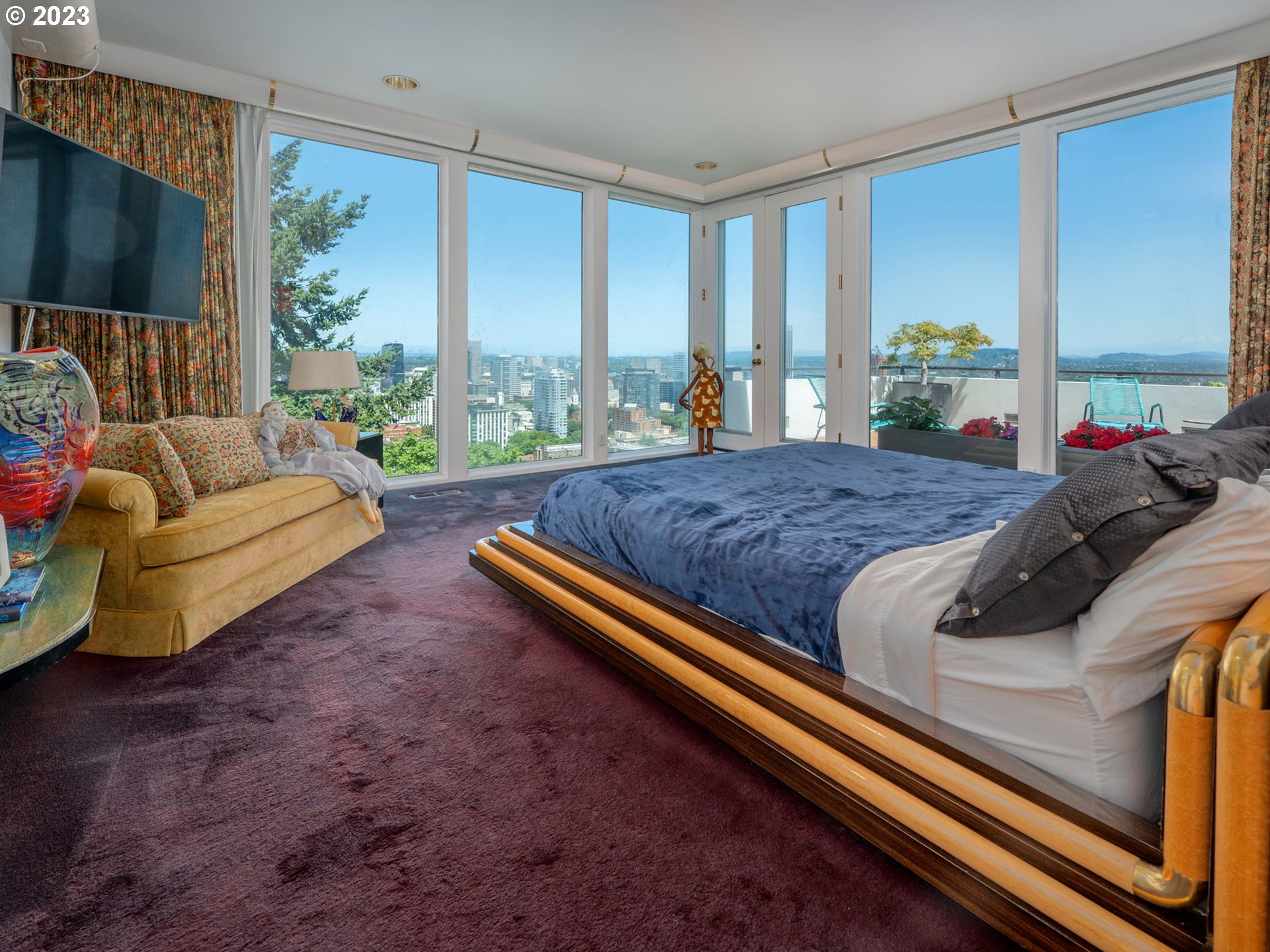 1405 Southwest Cardinell Drive Portland, OR 97201 - Photo 22 of 36 a bed sitting in a spacious bedroom next to a window