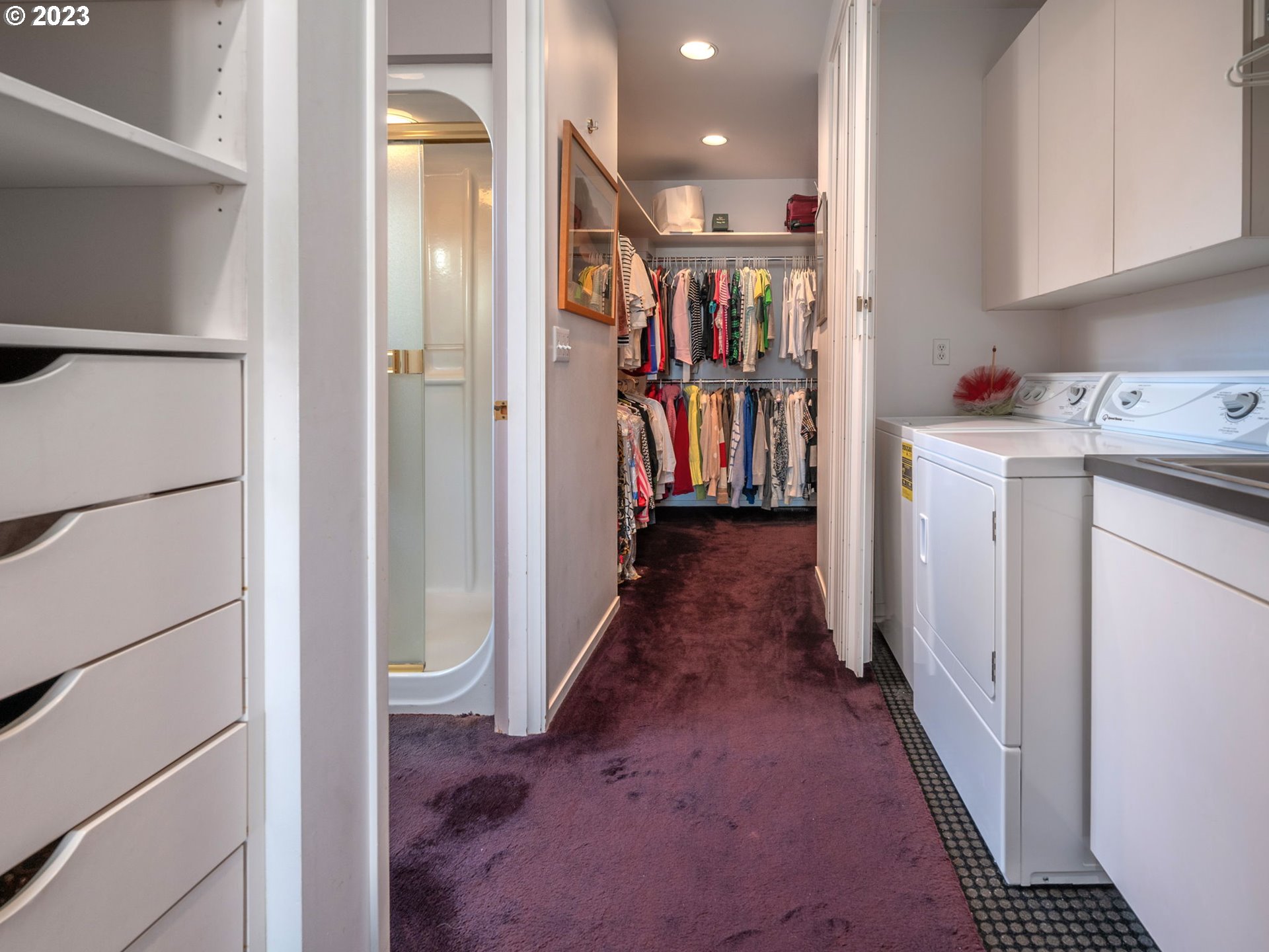 1405 Southwest Cardinell Drive Portland, OR 97201 - Photo 30 of 36 a storage room with wooden floor washer and dryer