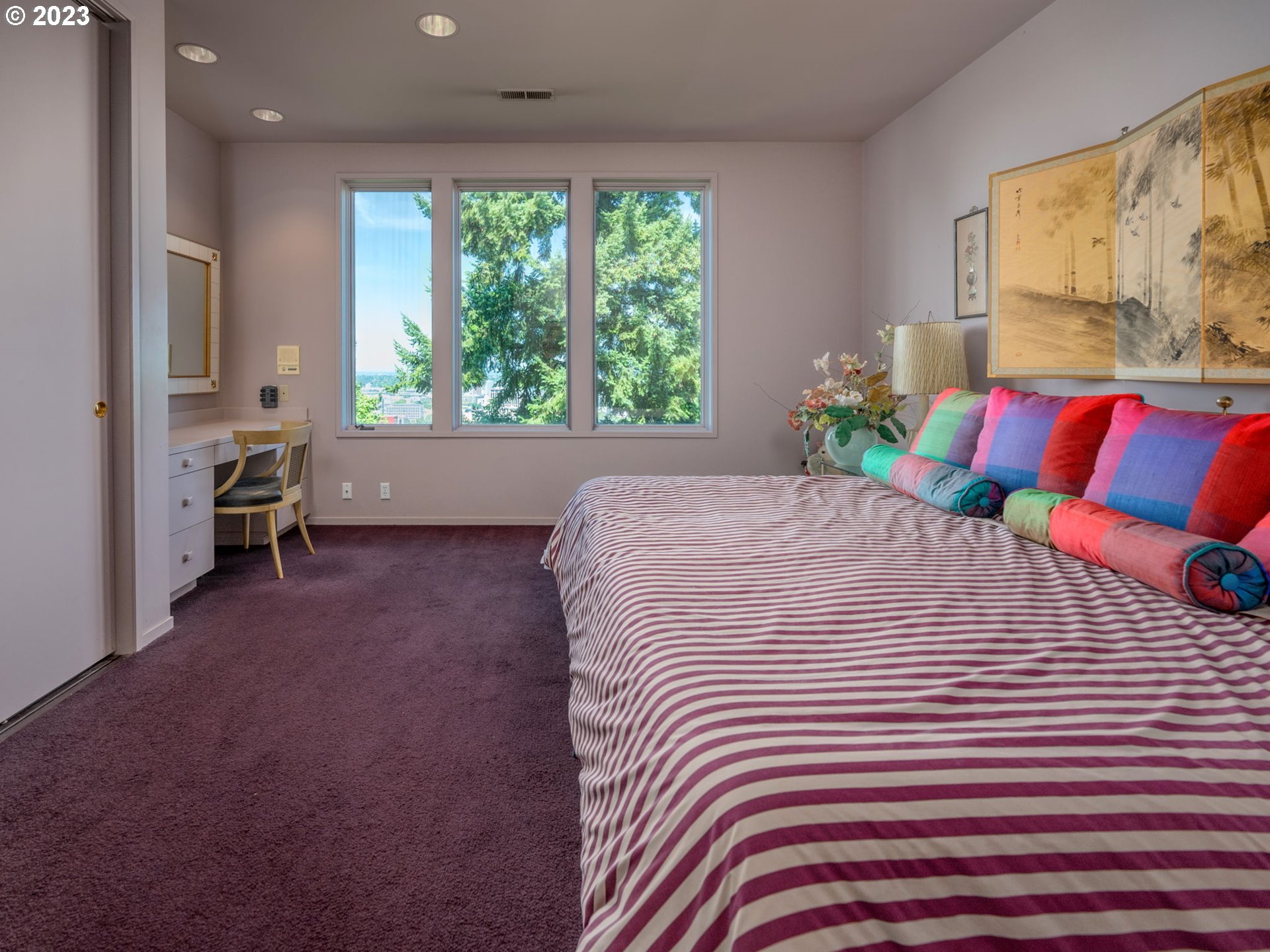 1405 Southwest Cardinell Drive Portland, OR 97201 - Photo 32 of 36 a bedroom with a large bed and a large window