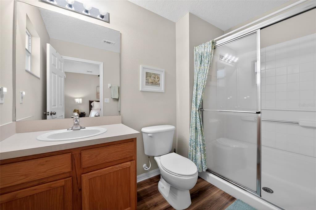 8538 Crystal Cove Loop Kissimmee, FL 34747 - Photo 20 of 59 a bathroom with a sink a toilet and shower
